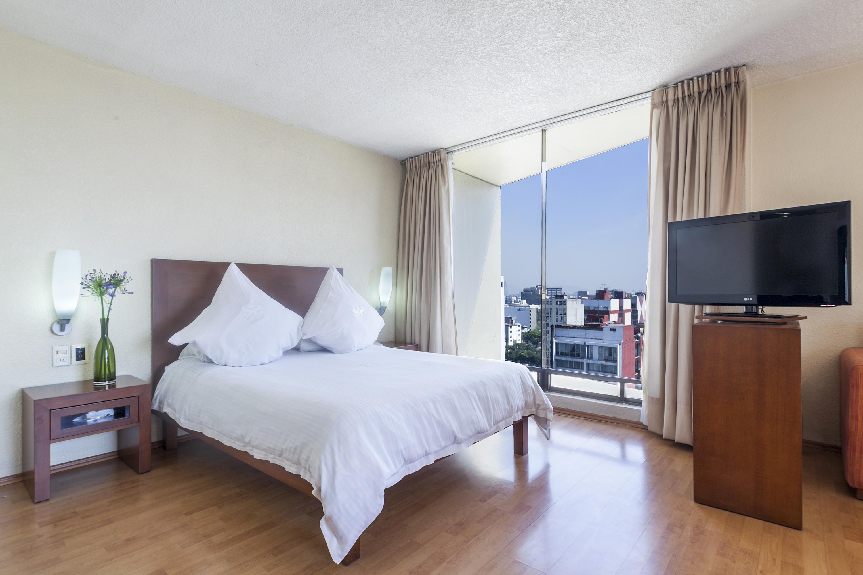 Exe Suites San Marino Ciudad de México Exteriér fotografie A bedroom at the hotel